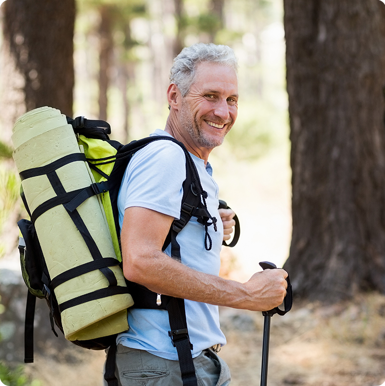 Happy man hiking after benign prostatic hyperplasia treatment